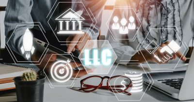 Limited Liability Company (LLC) Business Concept, Business team analyzing data and using tablet on desk with limited liability company icon on Vr screen.